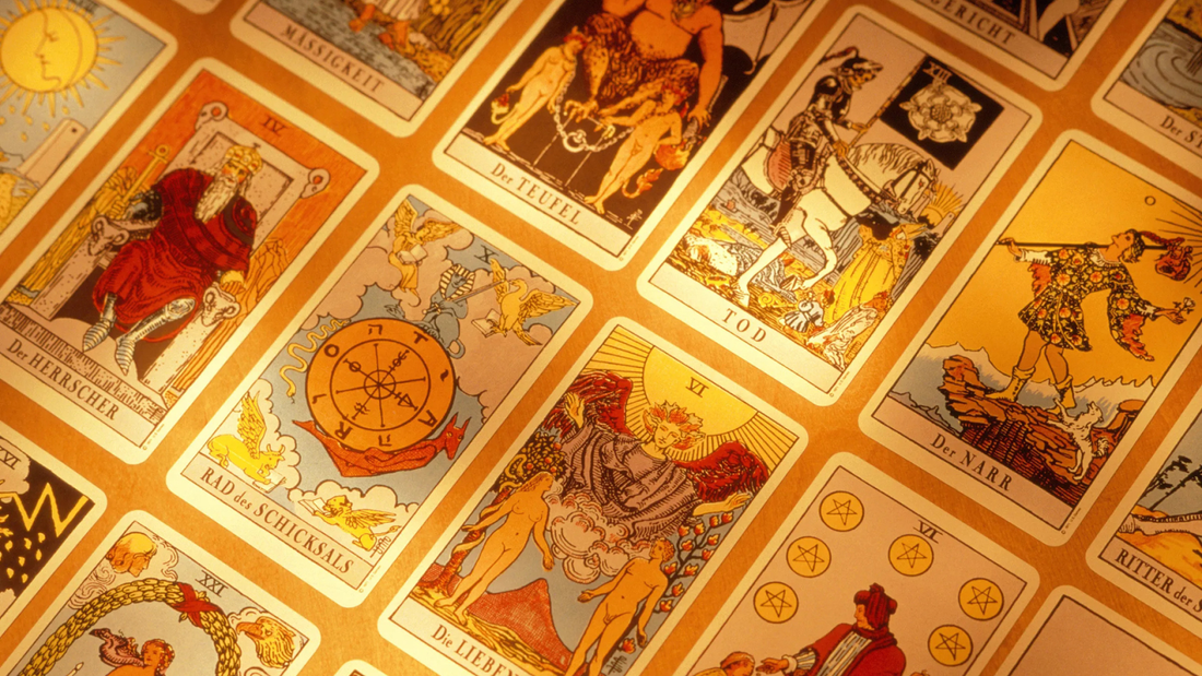 Colorful Tarot Cards Arranged on a Warm Surface