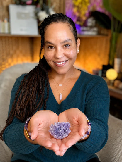 Dahlia holding a Grape Agate cluster in her open palms