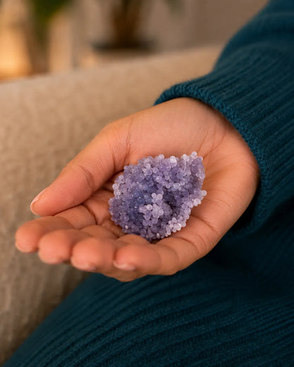 Grape Agate cluster resting in an open hand