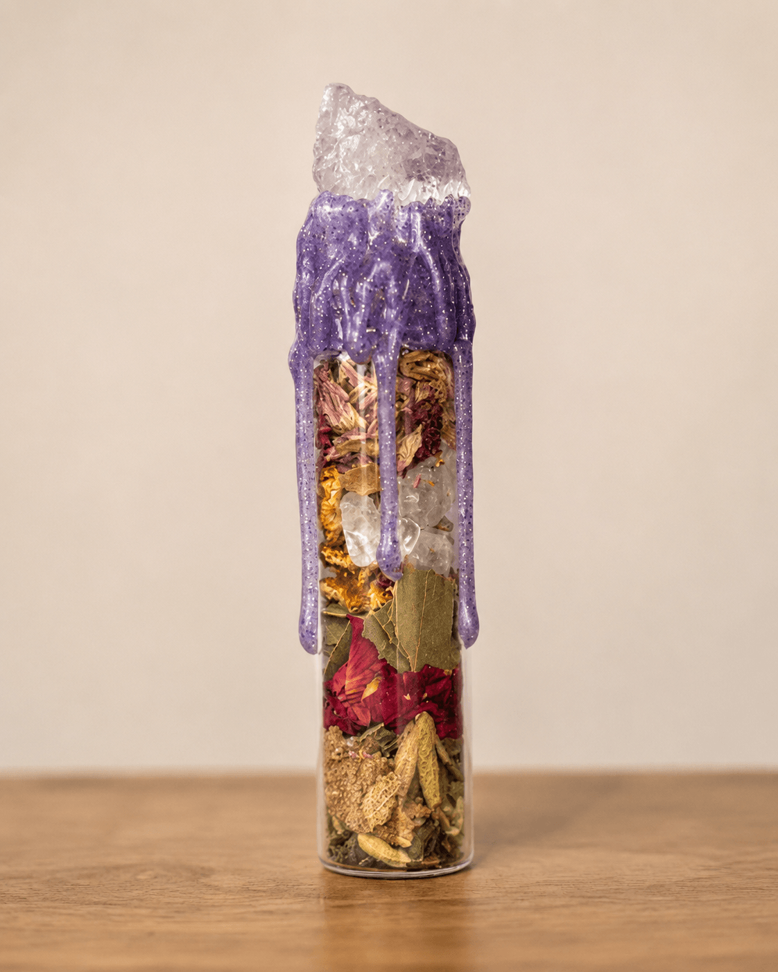 Devotion Spell Jar sealed with purple wax and a quartz point