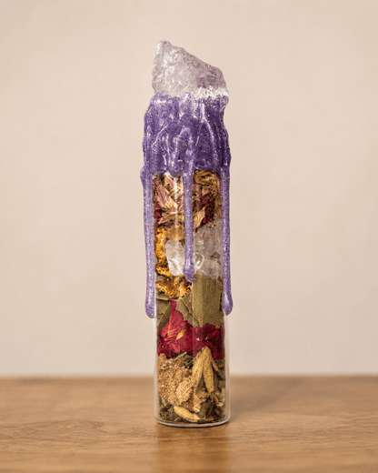 Devotion Spell Jar sealed with purple wax and a quartz point