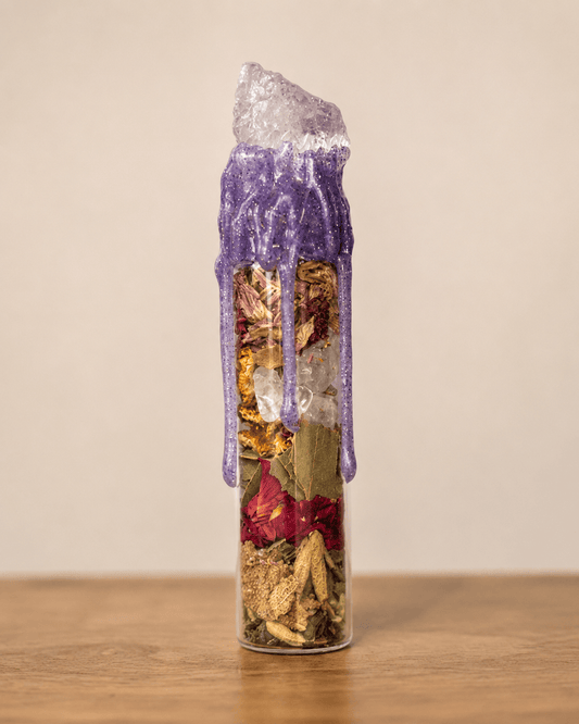 Devotion Spell Jar sealed with purple wax and a quartz point