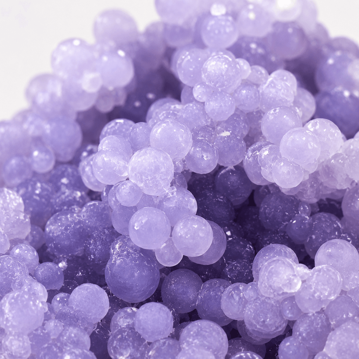 Macro close-up of Grape Agate's violet spheres